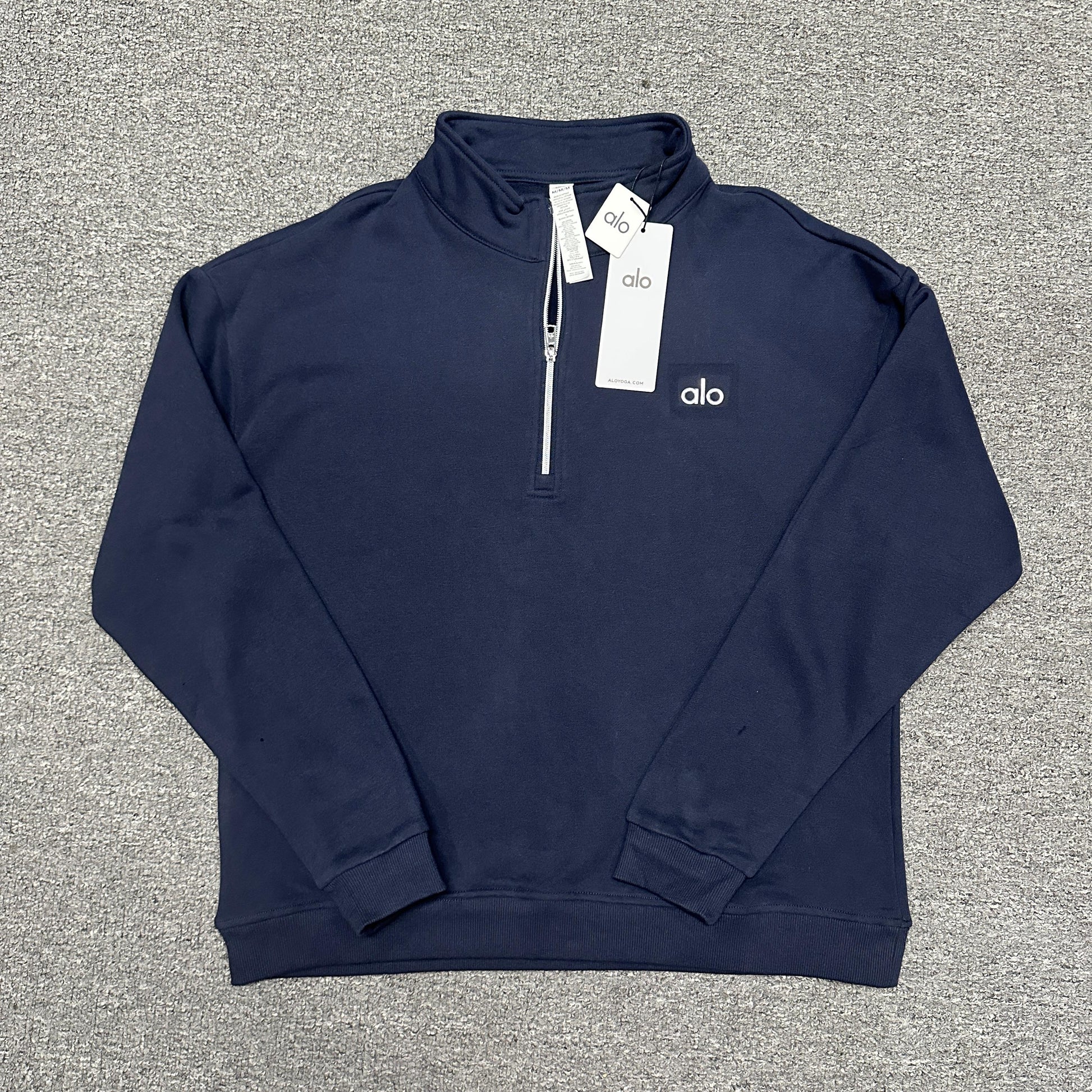 ALO Accolade 1/4 Zip Pullover in Navy front view with embroidered chest logo