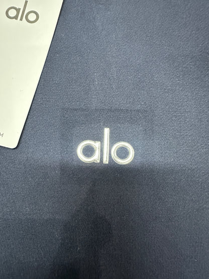 Embroidered ALO chest logo close-up on Navy Accolade quarter zip pullover