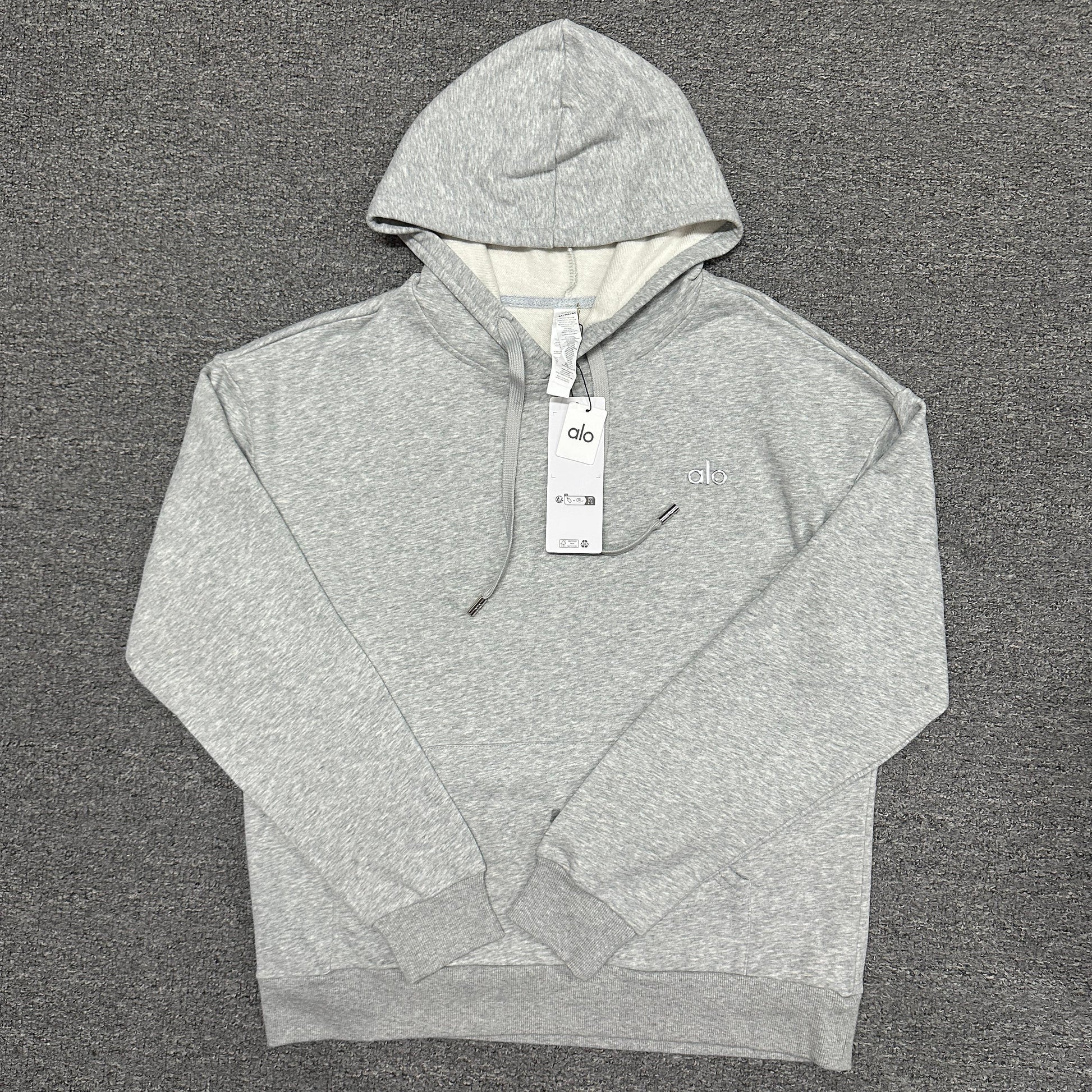 ALO Accolade Hoodie in Athletic Heather Grey front view with embroidered chest logo