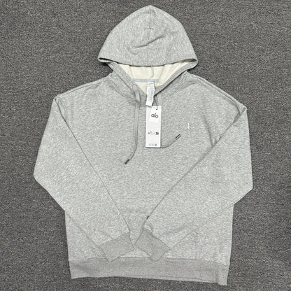 ALO Accolade Hoodie in Athletic Heather Grey front view with embroidered chest logo