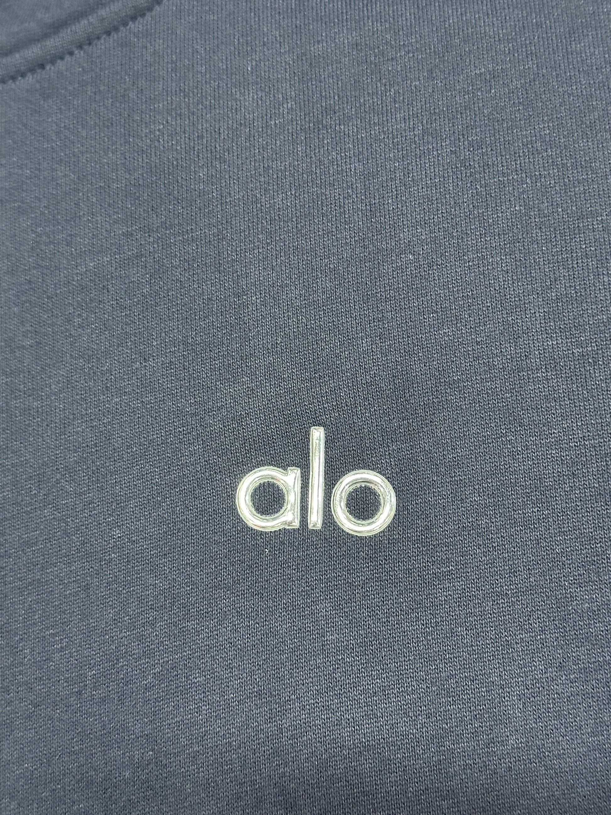 Embroidered ALO chest logo close-up on Navy Accolade Hoodie