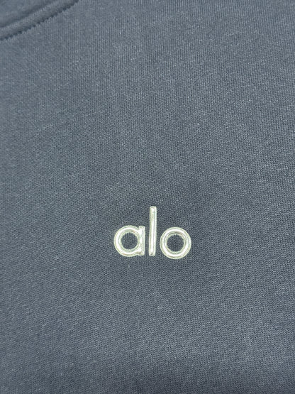 Embroidered ALO chest logo close-up on Navy Accolade Hoodie