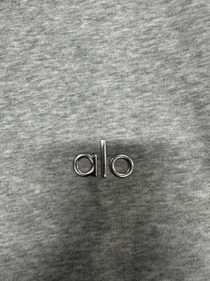 Embroidered ALO chest logo close-up on Athletic Heather Grey Accolade Hoodie
