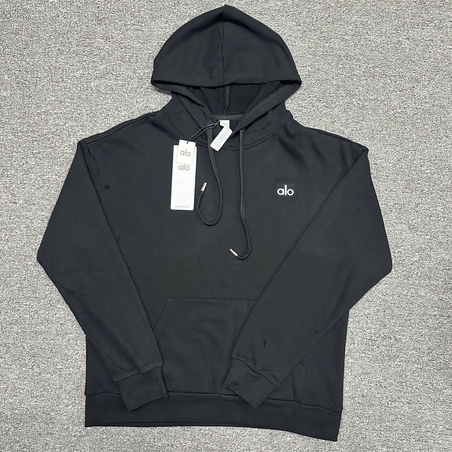ALO Accolade Hoodie in Black front view with embroidered chest logo