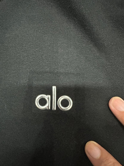Embroidered ALO chest logo close-up on Black Accolade Hoodie