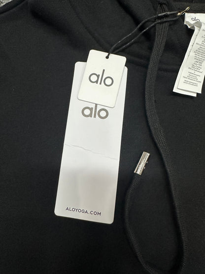 ALO Accolade Black hoodie neck label and size label close-up
ALO Accolade Black hoodie with branded retail hangtags
ALO Accolade Black hoodie care label and fabric information detail