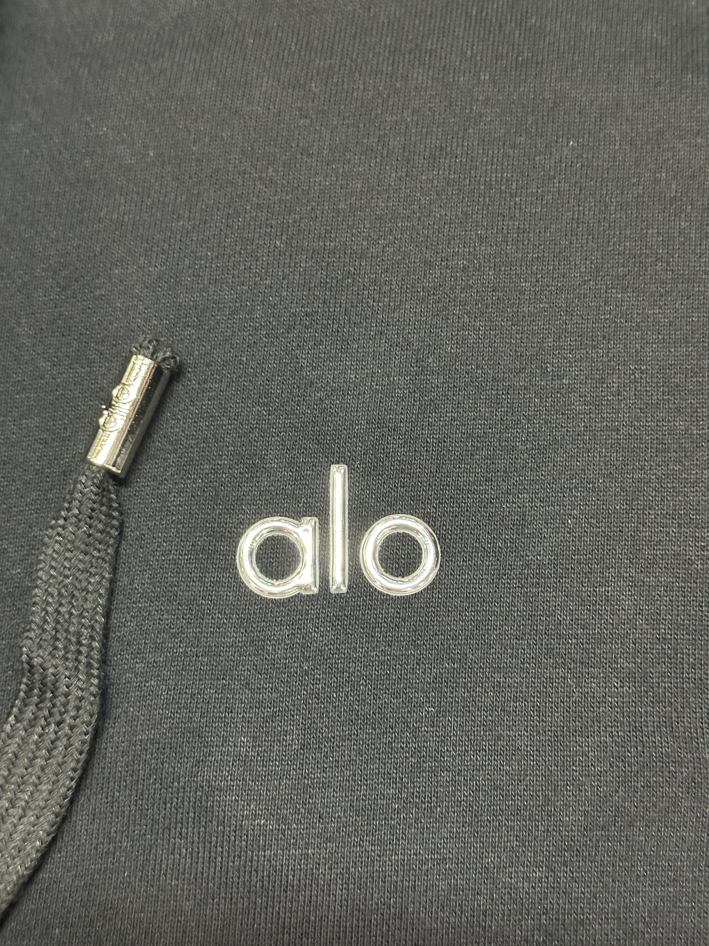 ALO embroidered chest logo placement on Black Accolade Full Zip Hoodie