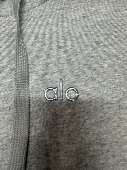 ALO embroidered chest logo placement on Athletic Heather Grey Accolade hoodie
Minimal embroidered ALO chest logo on Athletic Heather Grey full zip hoodie