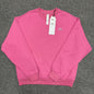 ALO Accolade Crew Neck Pullover in Paradise Pink front view with silver chest logo