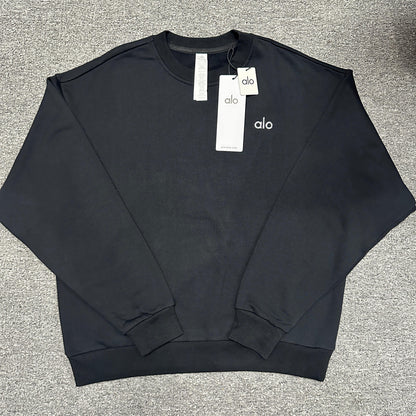 ALO Accolade Crew Neck Pullover in Black front view with silver chest logo
