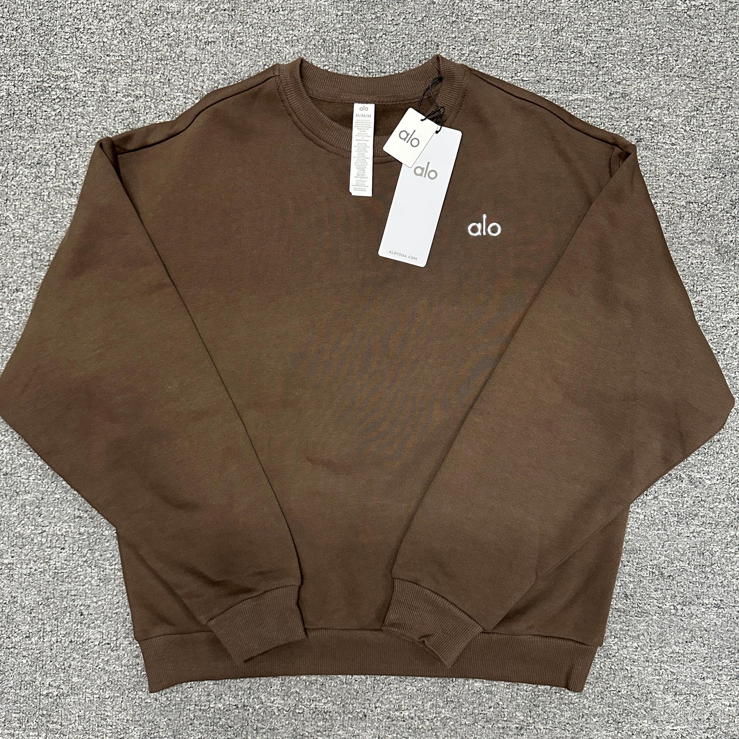 ALO Accolade Crew Neck Pullover in Espresso front view with silver chest logo