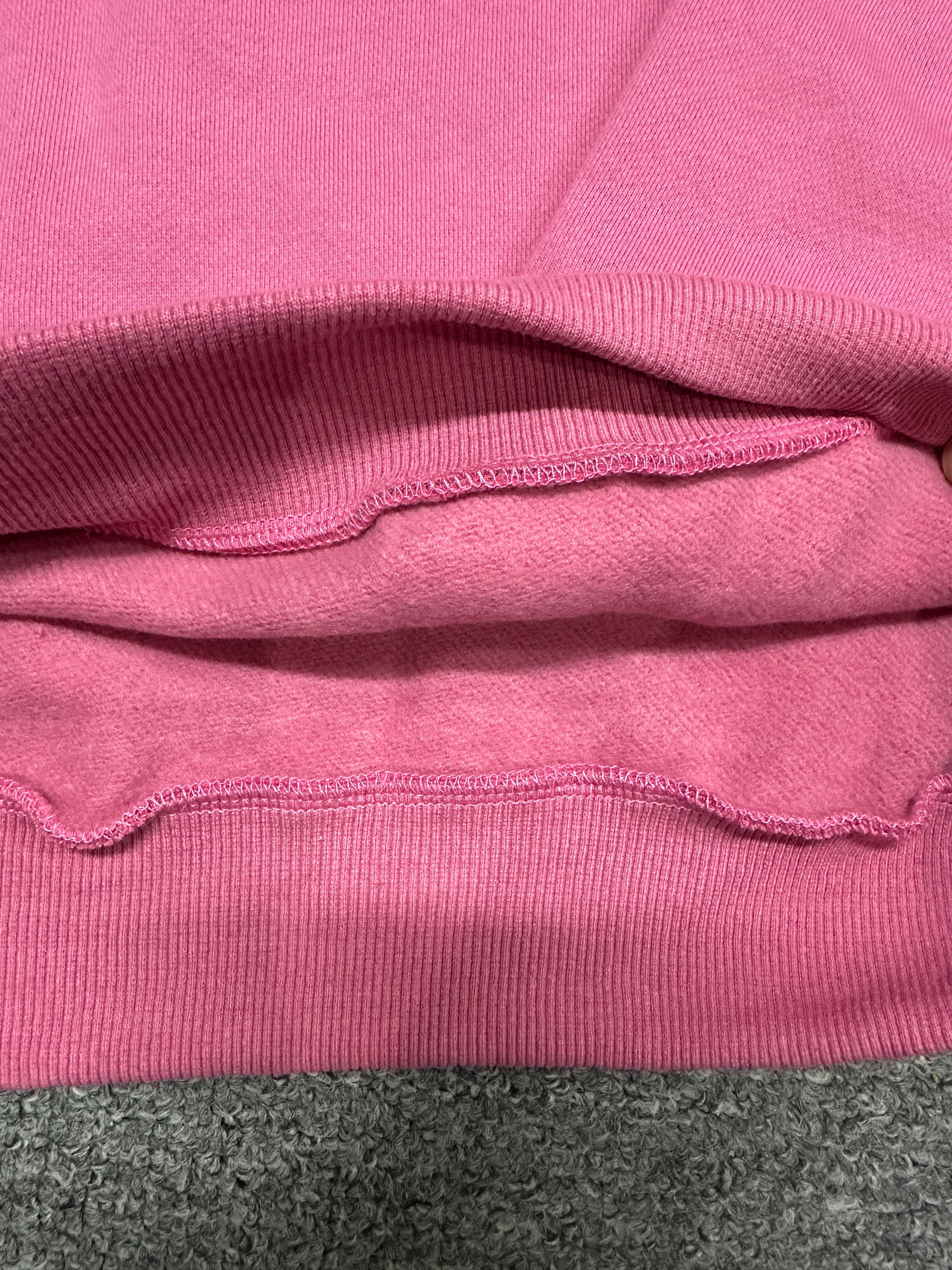 Soft fleecy French terry interior close-up of Paradise Pink ALO Accolade pullover