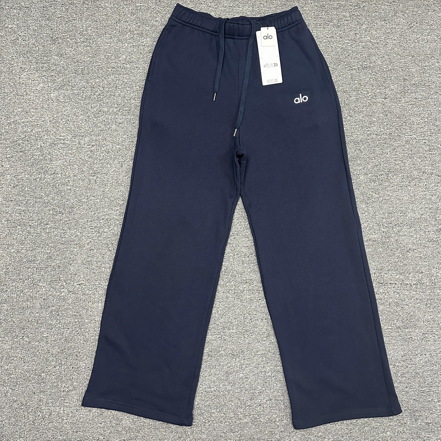 ALO Accolade Straight Leg Sweatpant in Navy front view with chrome logo detail