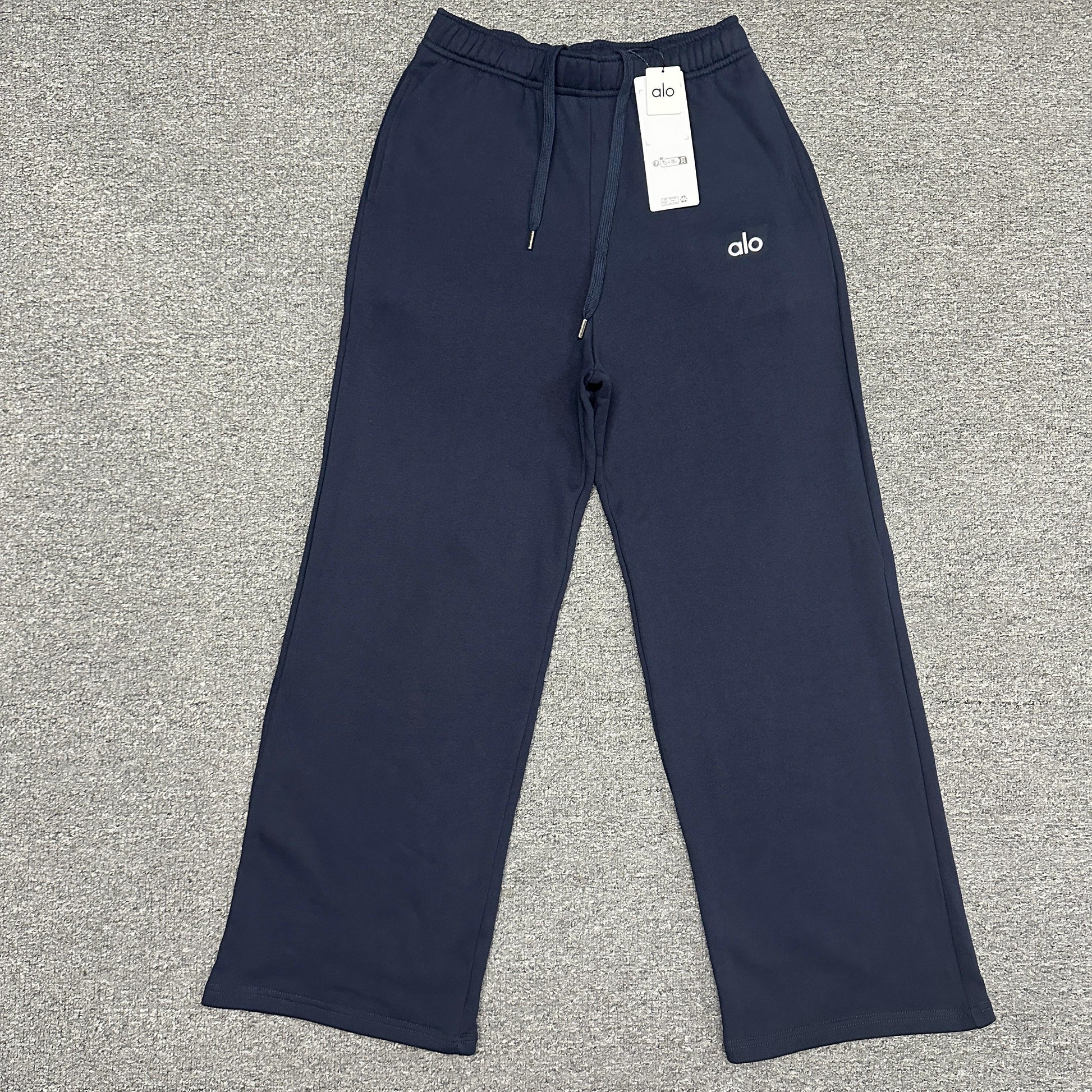 ALO Accolade Straight Leg Sweatpant in Navy front view with chrome logo detail