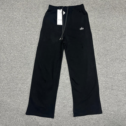 ALO Accolade Straight Leg Sweatpant in Black front view with chrome logo detail