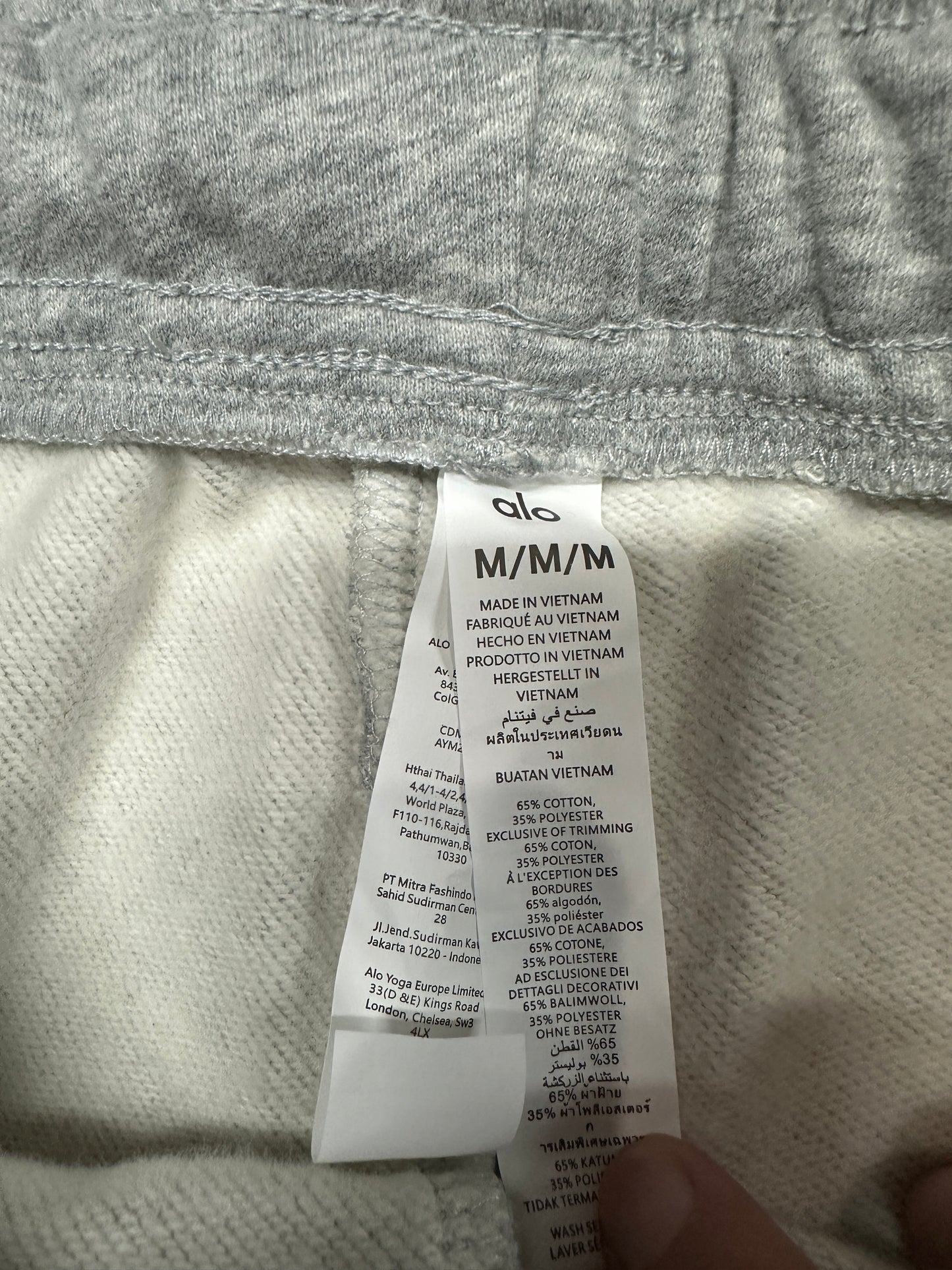 ALO Accolade Athletic Heather Grey sweatpant care label and fabric information detail