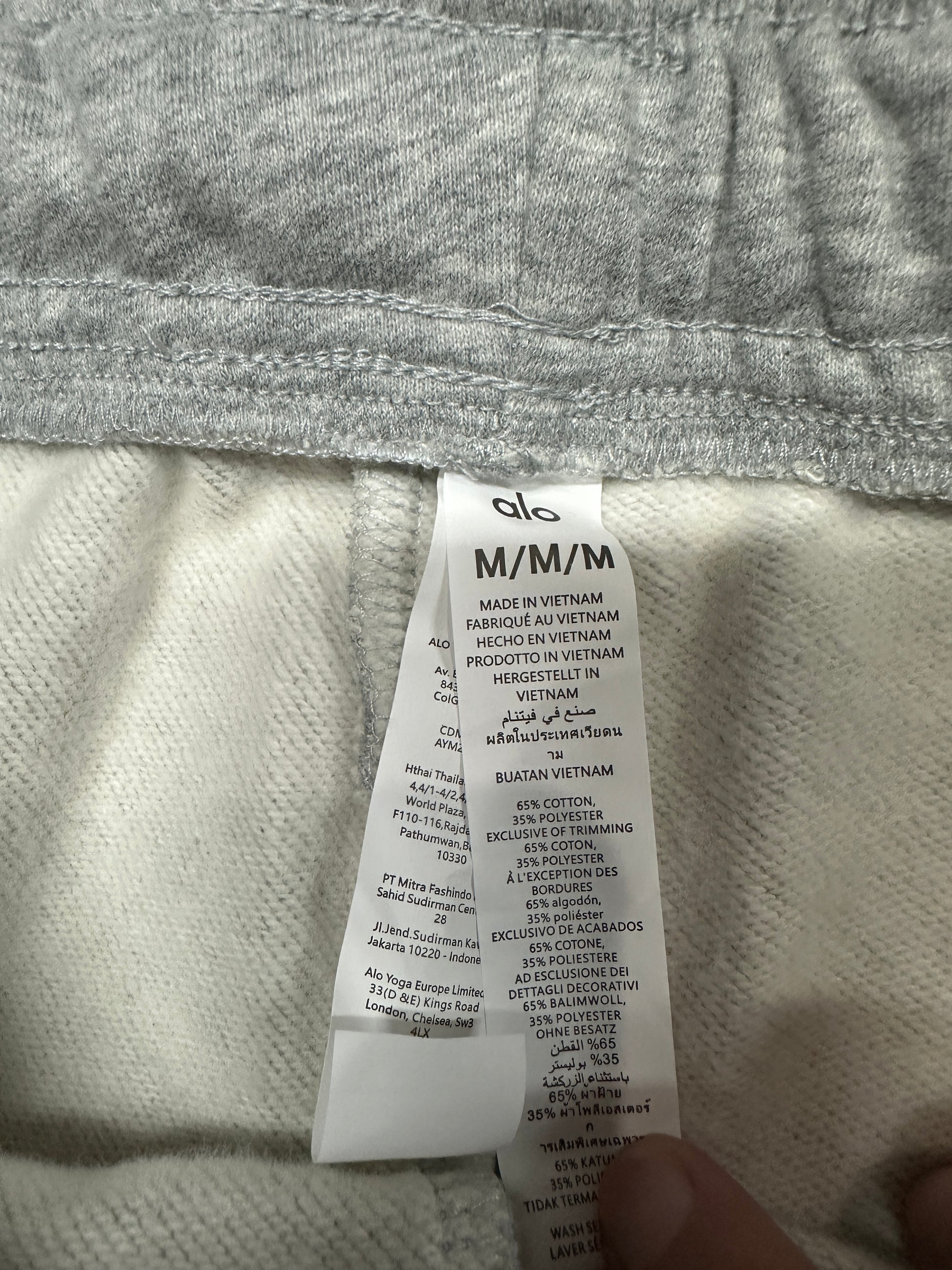 ALO Accolade Athletic Heather Grey sweatpant care label and fabric information detail
