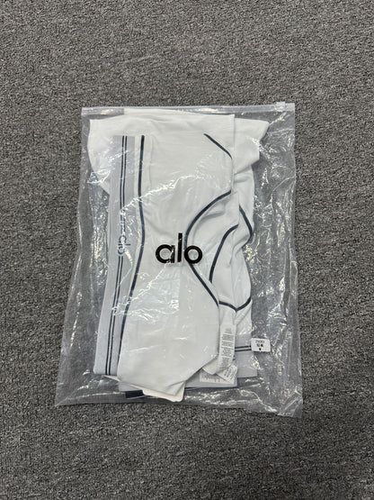 ALO Heart Throb White Black two-piece set folded inside branded packaging bag