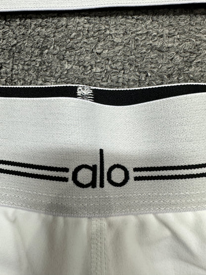 ALO logo elastic band close-up on White Black Heart Throb workout set
ALO Heart Throb White Black short elastic logo waistband construction detail