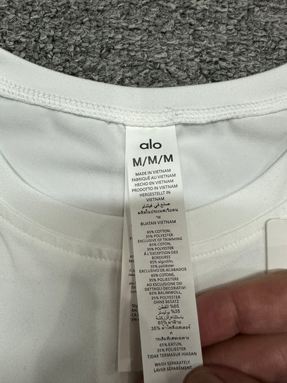 ALO Alosoft White crop tee crew neckline and stitching detail
ALO Alosoft White crop tee neck label and size label close-up
ALO Alosoft White crop tee care label and fabric information detail