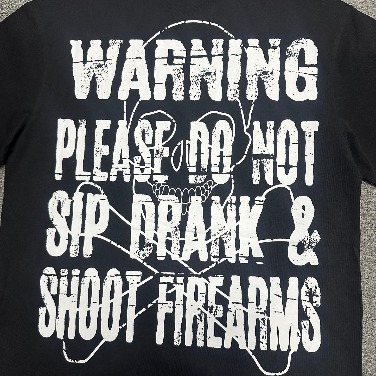 The "Hand Holding Bottle" graphic t-shirt