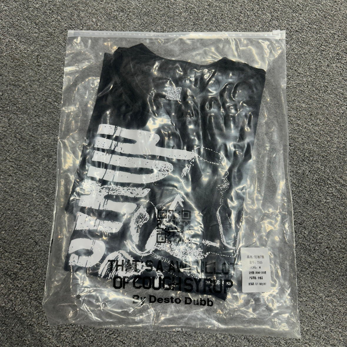 The "Hand Holding Bottle" graphic t-shirt