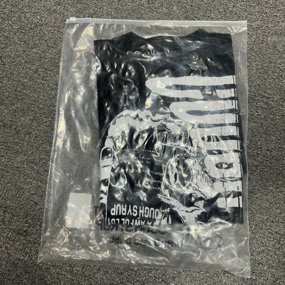 The "Hand Holding Bottle" graphic t-shirt