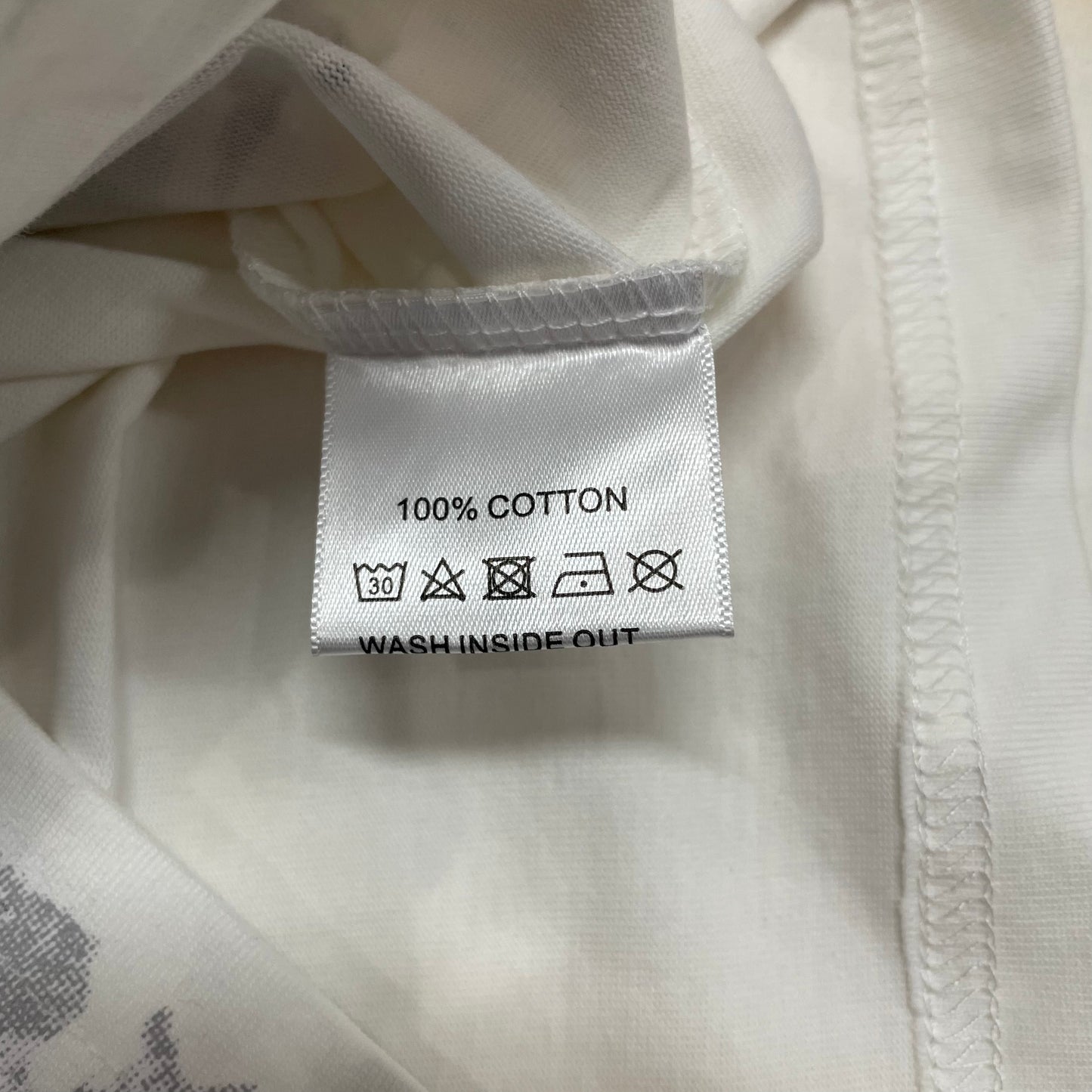 Vale Forever Americas Dream Tee double stitched bottom hem detail
Vale Forever Americas Dream Bling Tee wash care label