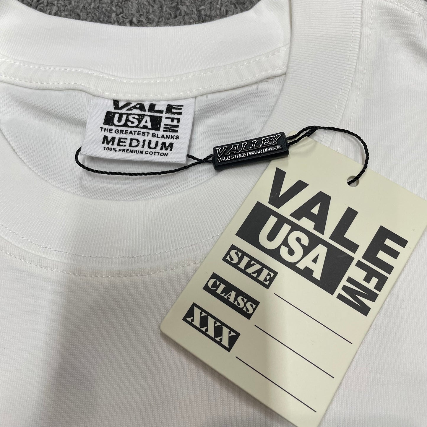 Vale Forever Dreams Tour Tee crew neck stitching detail
Vale Forever Dreams Tour Tee branded neck label close-up
Vale Forever Sade Bjork Dreams Tour Tee size label detail
Vale Forever Dreams Tour Tee branded hang tag detail