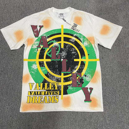 Vale Forever Target Tee Cream front view with Valley Dreams graphic
Vale Forever Target Tee full crosshair and Valley Dreams front graphic
Vale Forever Target Tee oversized green black and yellow target graphic
Vale Forever Target Tee distressed vintage graphic print close-up
Vale Forever Target Tee green and black crosshair graphic detail
Vale Forever Target Tee yellow crosshair print detail
Vale Forever Target Tee distressed vertical Valley lettering detail