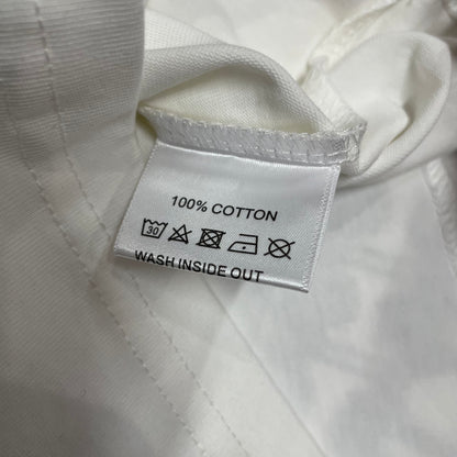 Vale Forever Scissorhands Tee double stitched bottom hem detail
Vale Forever Scissorhands Tee wash care label close-up