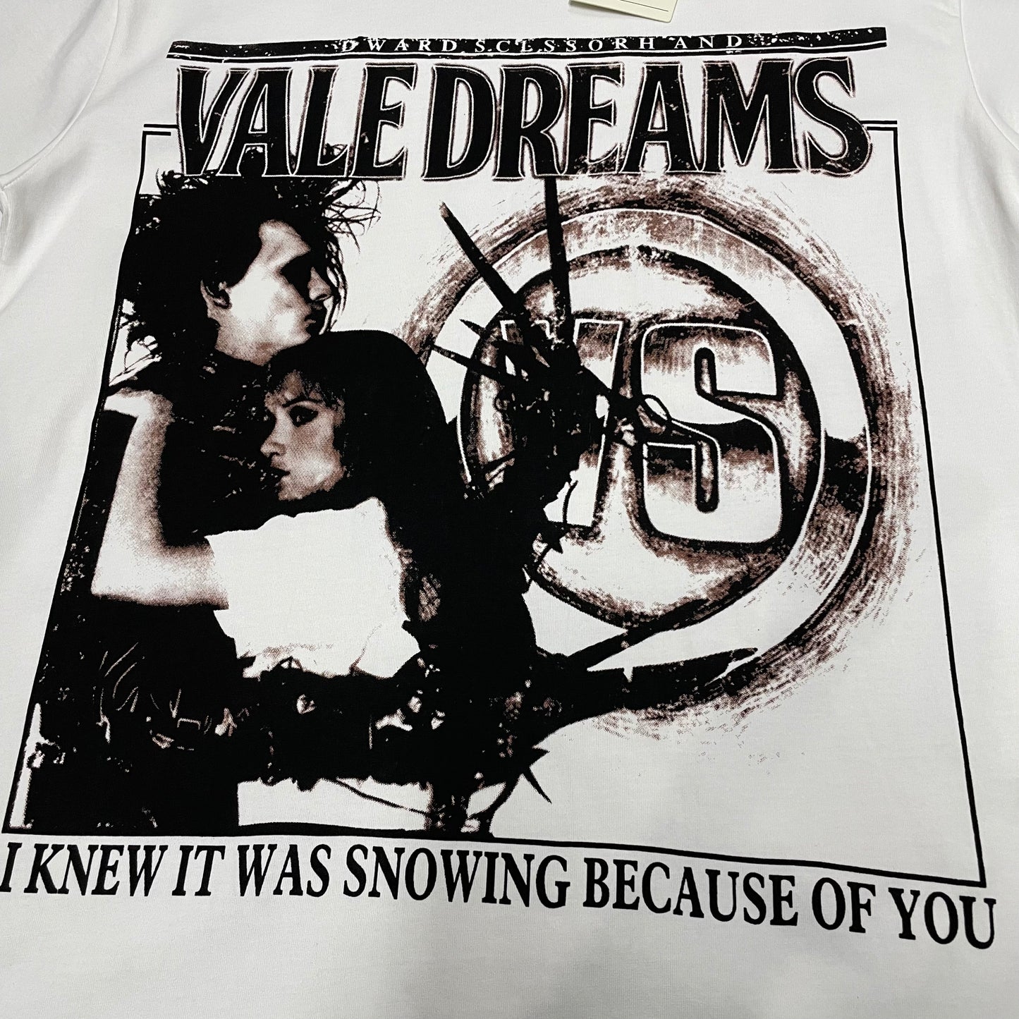 Vale Forever Scissorhands Tee full distressed front graphic
Vale Forever Scissorhands Tee vintage cinematic portrait front artwork
Vale Forever Scissorhands Tee distressed monochrome portrait print detail
Vale Forever Scissorhands Tee bold Vale Dreams lettering close-up
Vale Forever Scissorhands Tee distressed VS circular logo detail
Vale Forever Scissorhands Tee front slogan lettering print detail
Vale Forever Scissorhands Tee double-sided graphic design