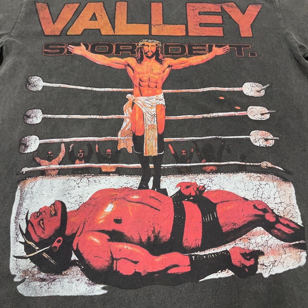 Vale Forever Heaven Boxer Tee full wrestling-ring front graphic
Vale Forever Heaven Boxer Tee wrestling-ring victory scene artwork
Vale Forever Heaven Boxer Tee distressed vintage graphic close-up
Vale Forever Heaven Boxer Tee distressed red Valley lettering detail
Vale Forever Heaven Boxer Tee standing wrestler graphic detail
Vale Forever Heaven Boxer Tee fallen wrestler graphic detail
Vale Forever Heaven Boxer Tee wrestling ring and ropes graphic detail