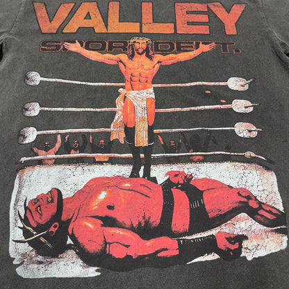 Vale Forever Heaven Boxer Tee full wrestling-ring front graphic
Vale Forever Heaven Boxer Tee wrestling-ring victory scene artwork
Vale Forever Heaven Boxer Tee distressed vintage graphic close-up
Vale Forever Heaven Boxer Tee distressed red Valley lettering detail
Vale Forever Heaven Boxer Tee standing wrestler graphic detail
Vale Forever Heaven Boxer Tee fallen wrestler graphic detail
Vale Forever Heaven Boxer Tee wrestling ring and ropes graphic detail