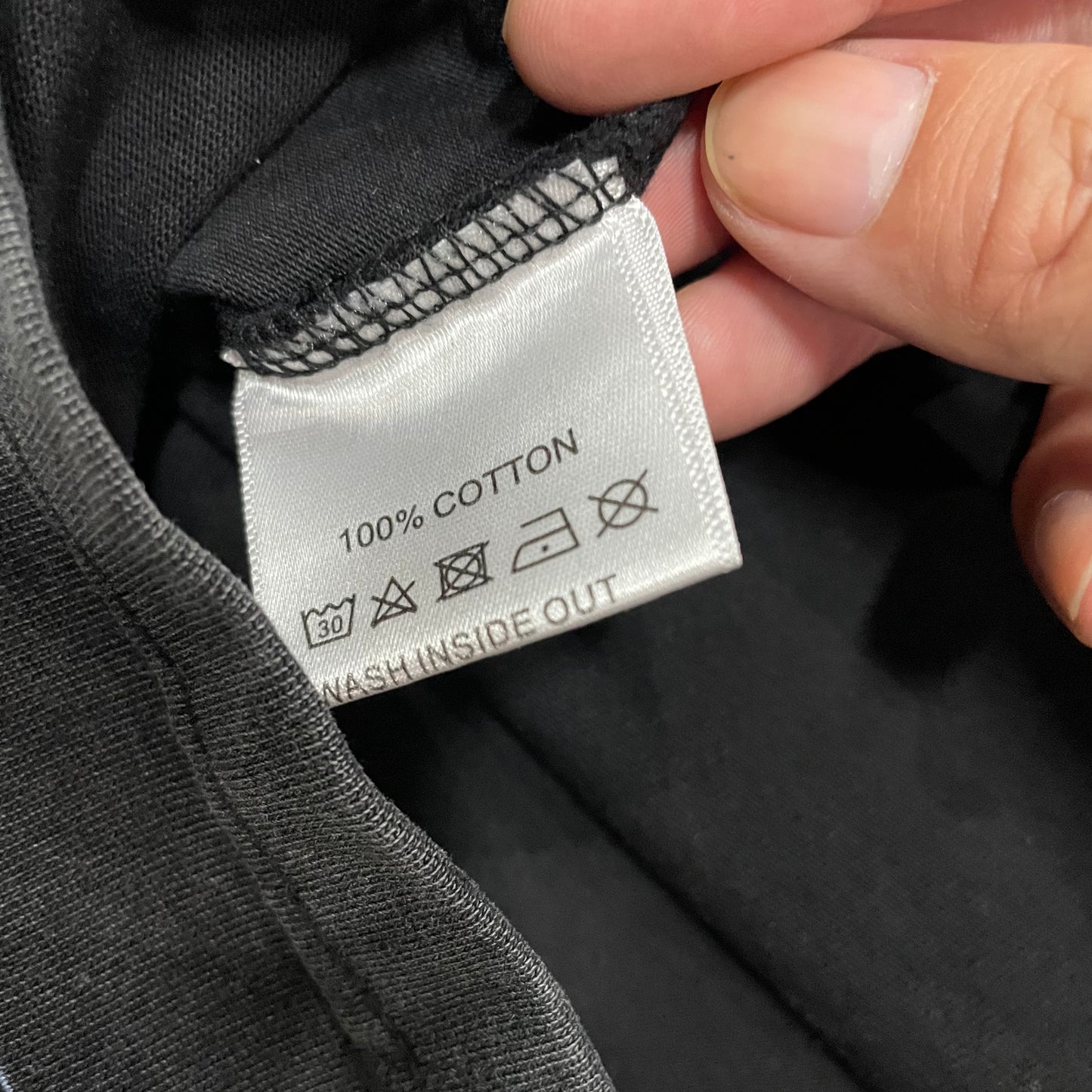 Vale Forever Marvins Dreams Tee double stitched bottom hem detail
Vale Forever Marvins Dreams Tee wash care label close-up