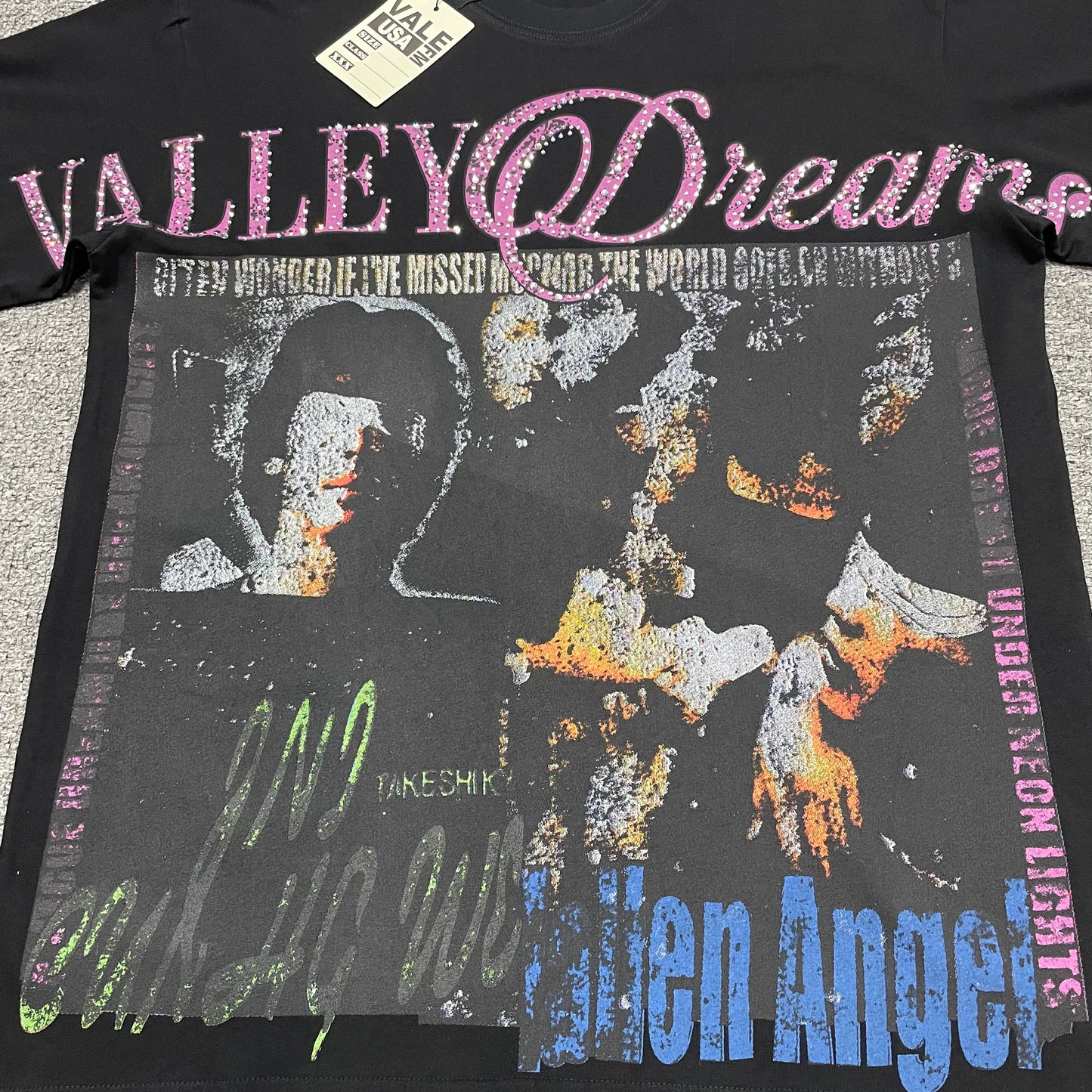 Vale Forever Fallen Bling Tee full Fallen Angel collage front graphic
Vale Forever Fallen Bling Tee distressed Fallen Angel collage artwork
Vale Forever Fallen Bling Tee distressed portrait collage print detail
Vale Forever Fallen Bling Tee pink crystal Valley Dreams lettering
Vale Forever Fallen Bling Tee pink rhinestone embellishment close-up
Vale Forever Fallen Bling Tee crystal Valley lettering detail
Vale Forever Fallen Bling Tee pink Dreams script lettering detail