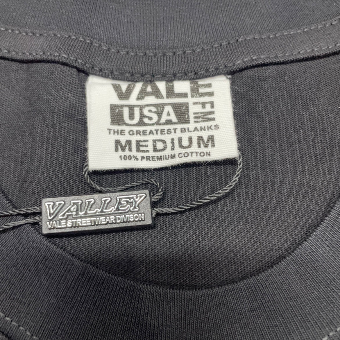 Vale Forever Fallen Bling Tee crew neck stitching detail
Vale Forever Fallen Bling Tee branded neck label close-up
Vale Forever Fallen Bling Tee Black size label detail
