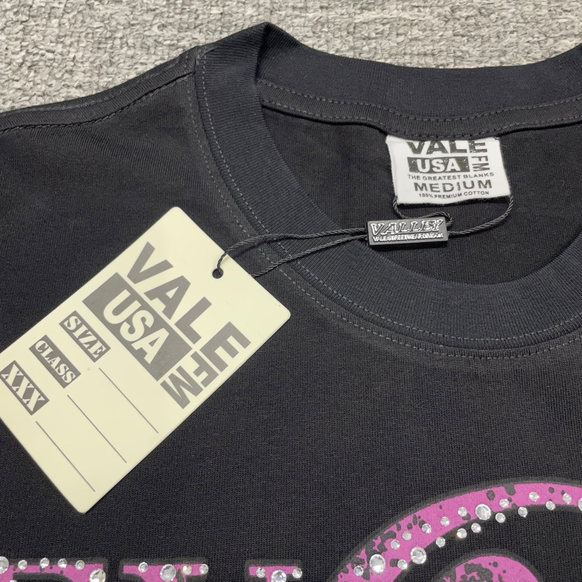 Vale Forever Fallen Bling Tee crew neck stitching detail
Vale Forever Fallen Bling Tee branded neck label close-up
Vale Forever Fallen Bling Tee Black size label detail
Vale Forever Fallen Bling Tee branded hang tag detail