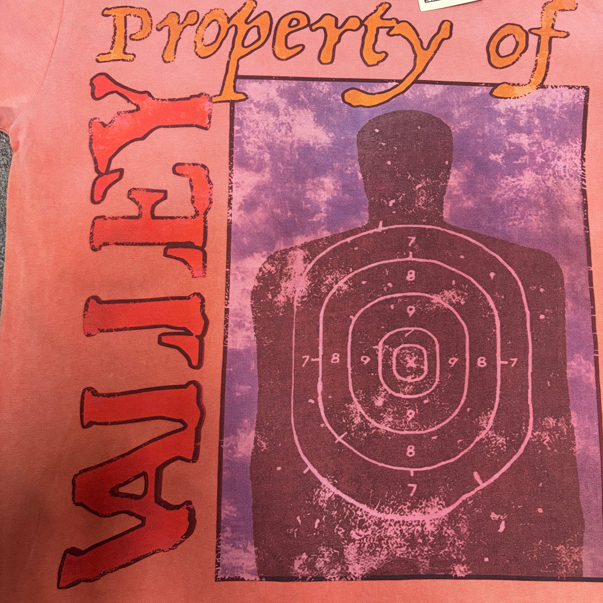 Vale Forever Property of Vale Target Tee full silhouette target front graphic
Vale Forever Property of Vale Tee silhouette shooting target artwork
Vale Forever Property of Vale Target Tee distressed vintage print close-up
Vale Forever Property of Vale Tee silhouette target figure graphic detail
Vale Forever Property of Vale Tee orange Property of lettering detail
Vale Forever Property of Vale Target Tee vertical Vale lettering detail
Vale Forever Property of Vale Target Tee numbered target graphic detail