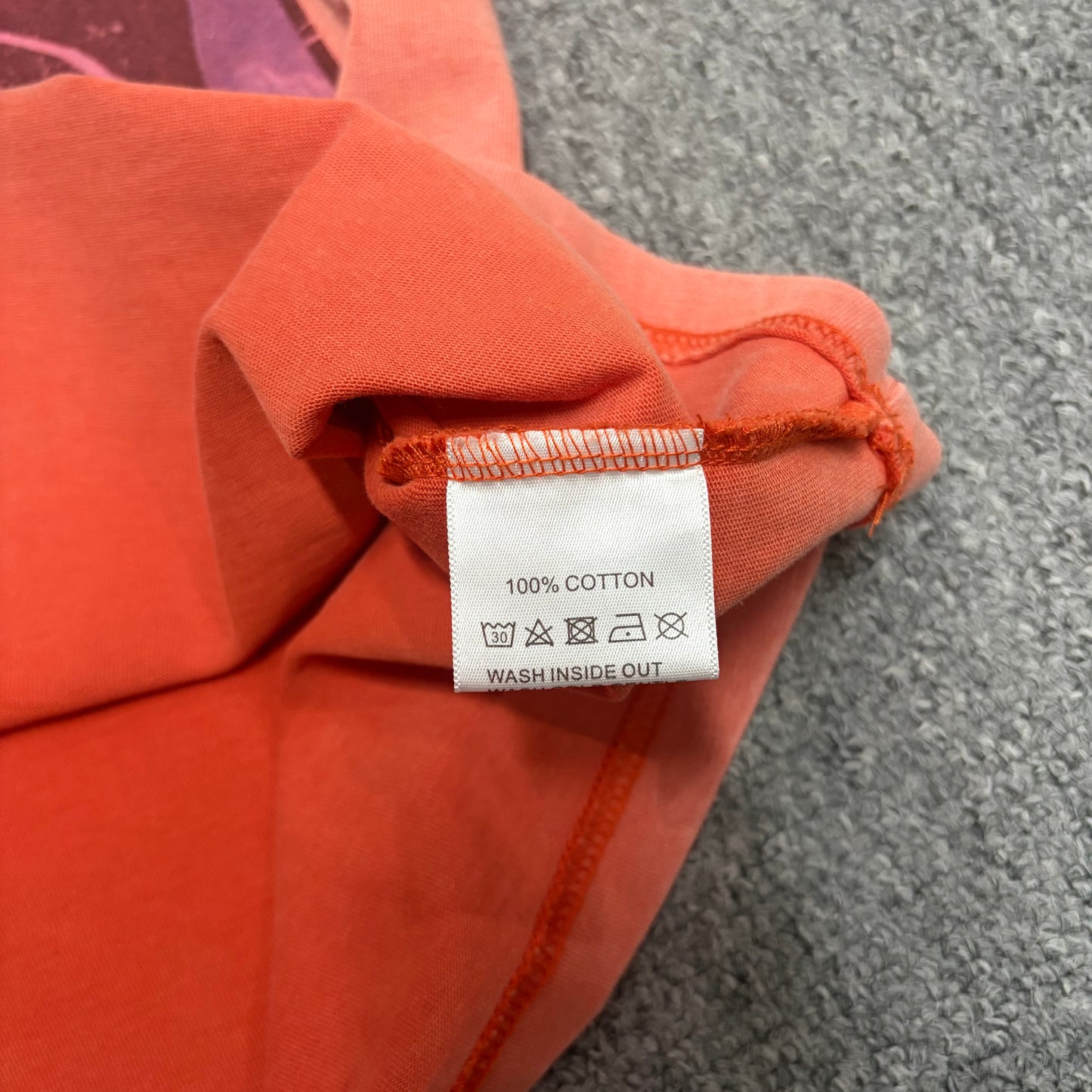 Vale Forever Property of Vale Target Tee double stitched bottom hem detail
Vale Forever Property of Vale Target Tee wash care label close-up