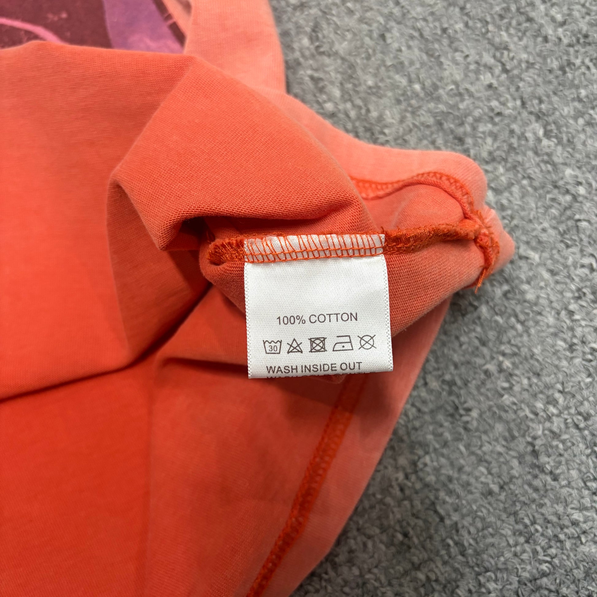 Vale Forever Property of Vale Target Tee double stitched bottom hem detail
Vale Forever Property of Vale Target Tee wash care label close-up