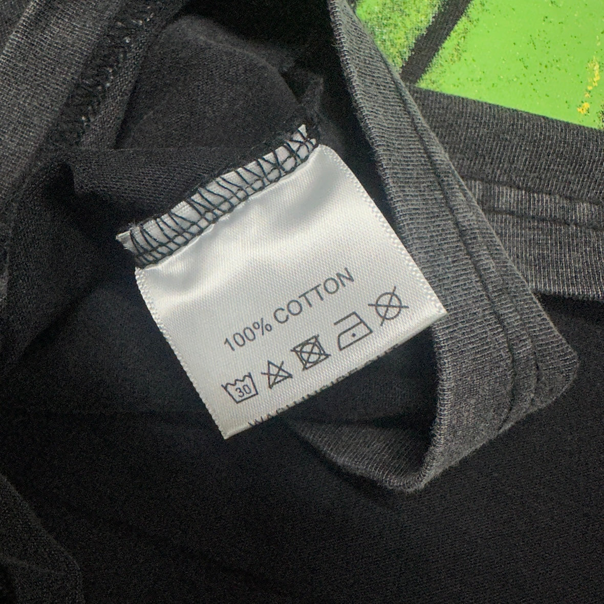 Vale Forever Skyline Bling Tee double stitched bottom hem detail
Vale Forever Skyline Bling Tee wash care label close-up