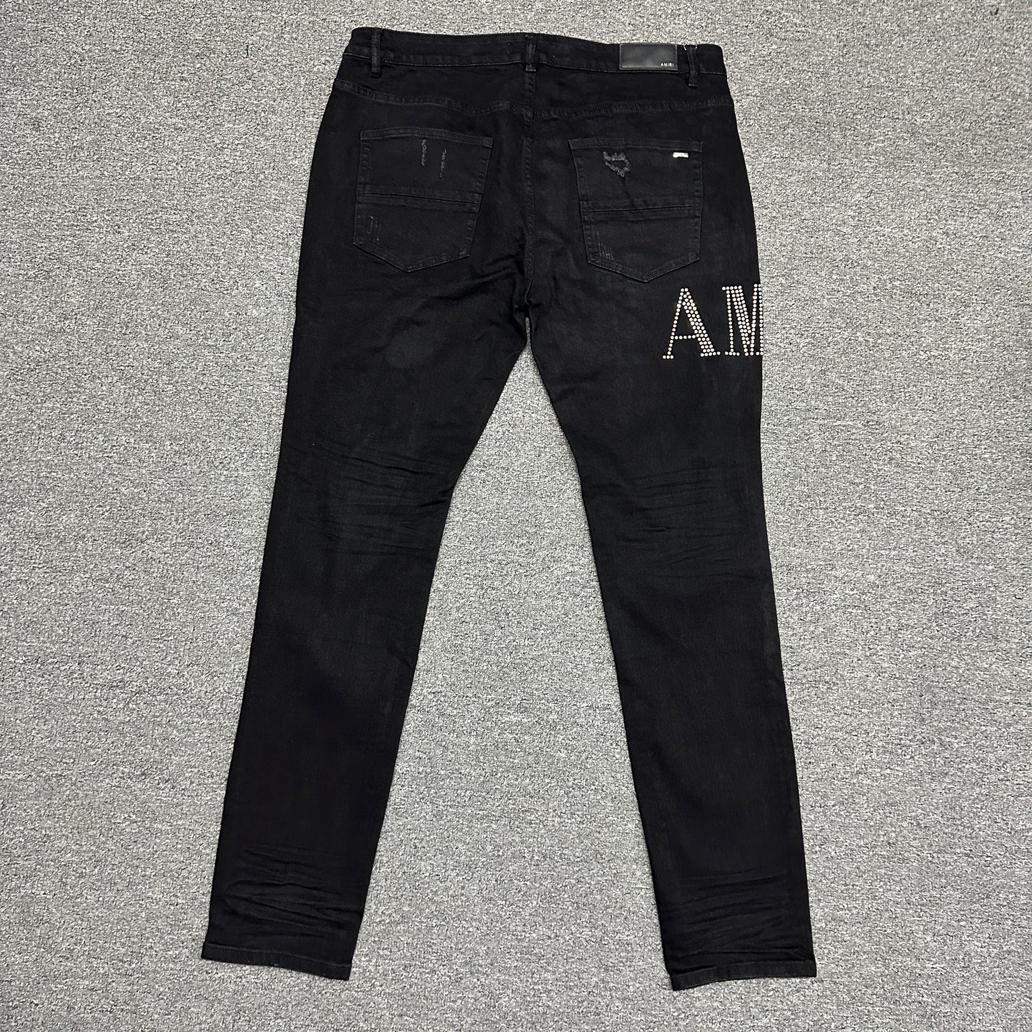 AMIRI Staggered Logo Distressed Skinny Jeans Black