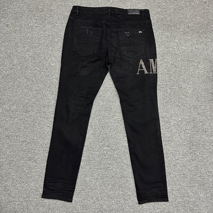 AMIRI Staggered Logo Distressed Skinny Jeans Black