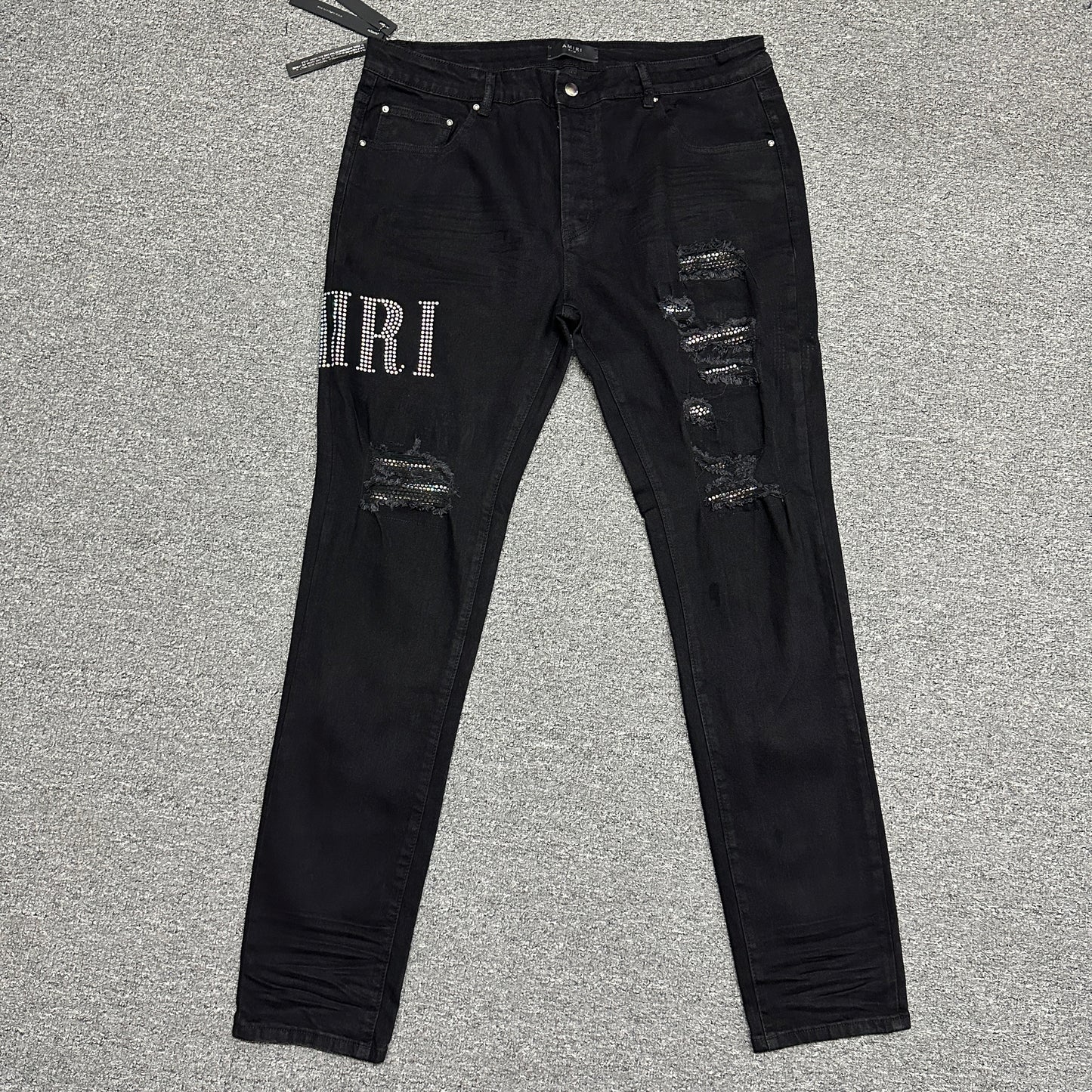 AMIRI Staggered Logo Distressed Skinny Jeans Black