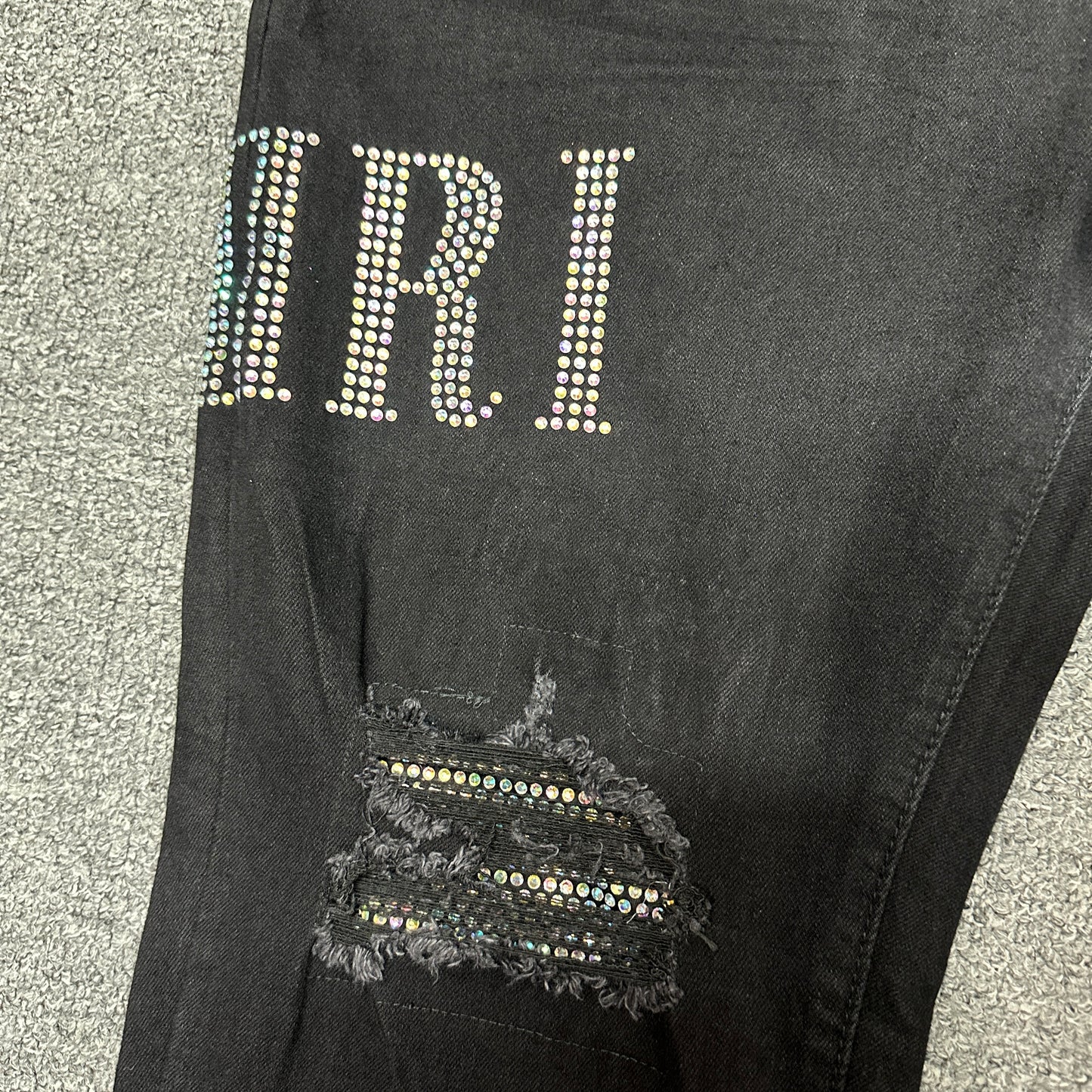 AMIRI Staggered Logo Distressed Skinny Jeans Black