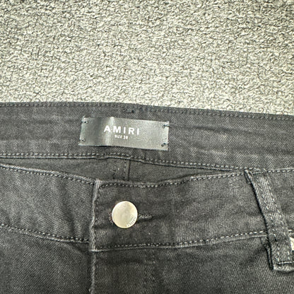 AMIRI Staggered Logo Distressed Skinny Jeans Black