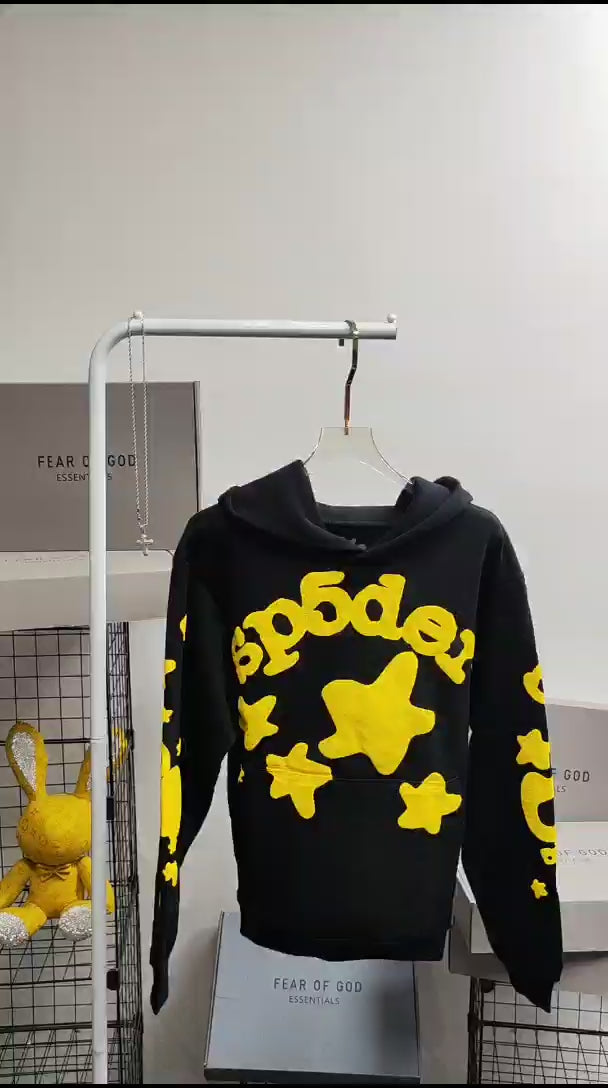 Sp5der Beluga Hoodie Onyx Yellow front view with raised yellow lettering and oversized star graphics