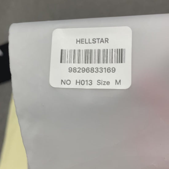 Hellstar Helmet Tee in Cream and Black front view with oversized helmeted face graphic