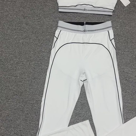 ALO Heart Throb Bra and High-Waist Legging Set in White Black front view